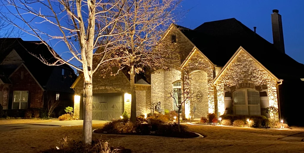 Landscape lighting pathlights and house lights create a beautiful night view.