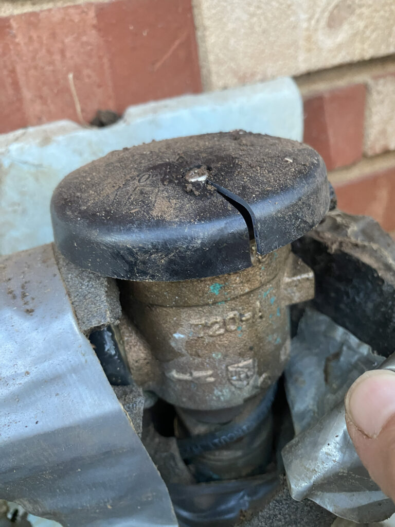 Sprinkler System Backflow Freeze Damage at a Tulsa, OK Home taken before backflow repair.